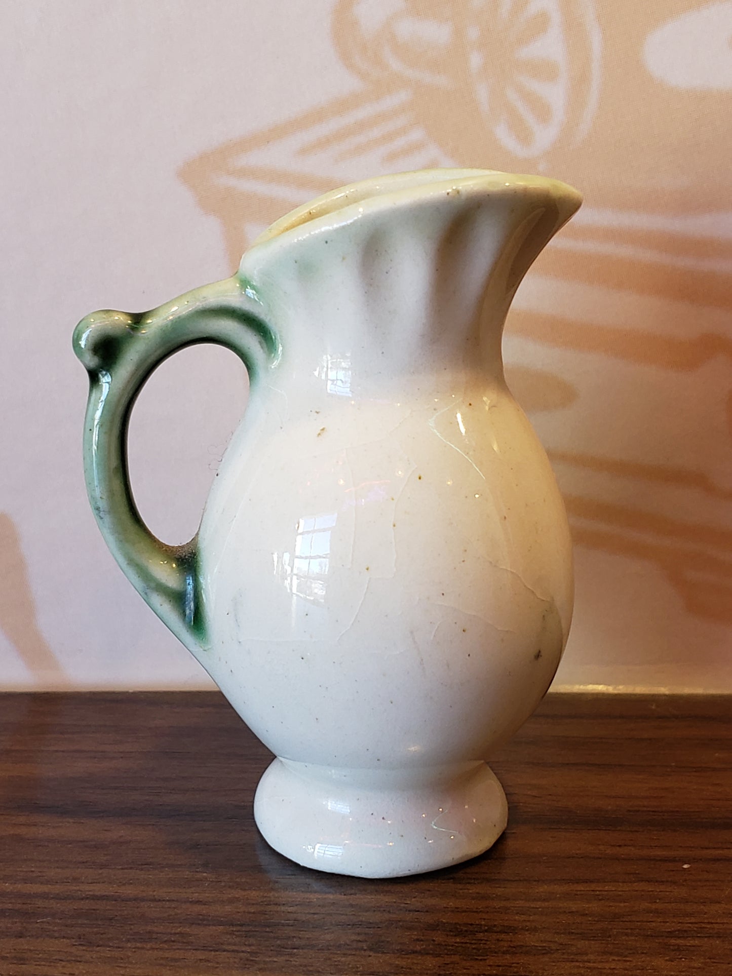 Miniature pottery pitcher with home scene