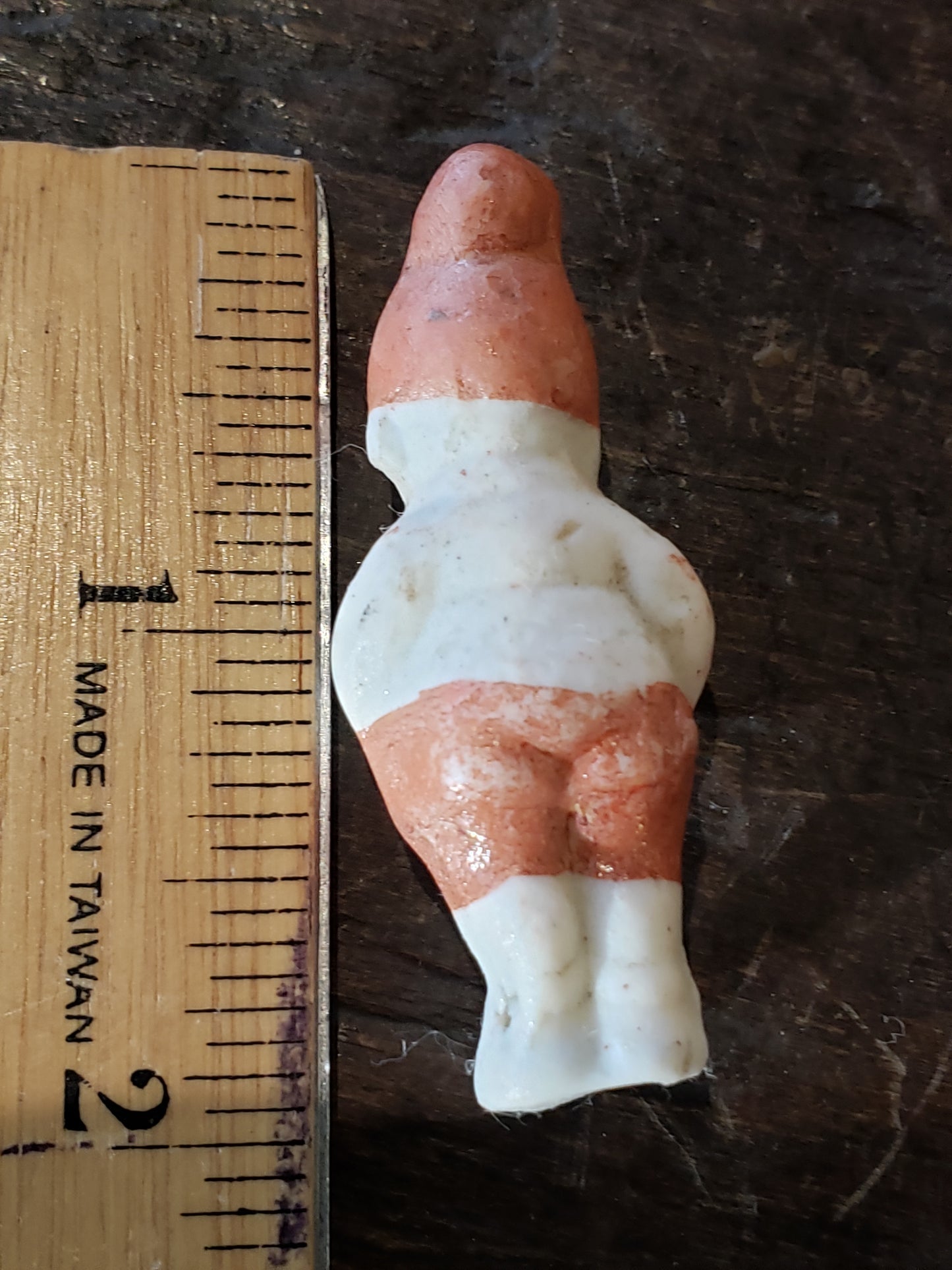 Tiny bisque doll