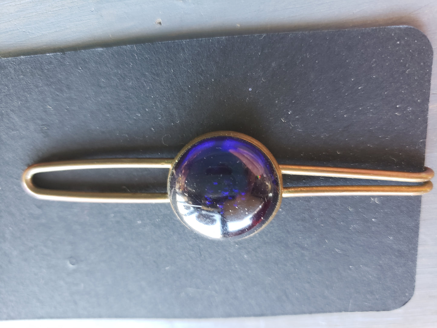 Brass and blue stone tie clip