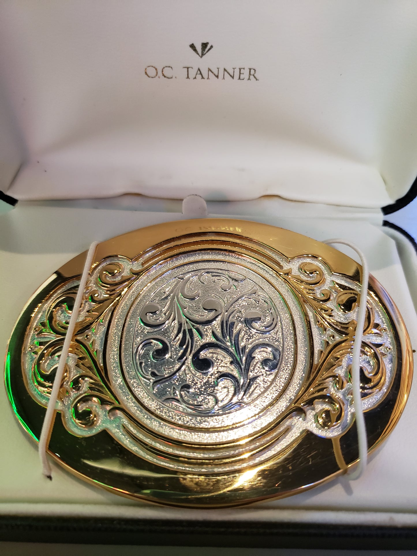 OC Tanner solid brass belt buckle