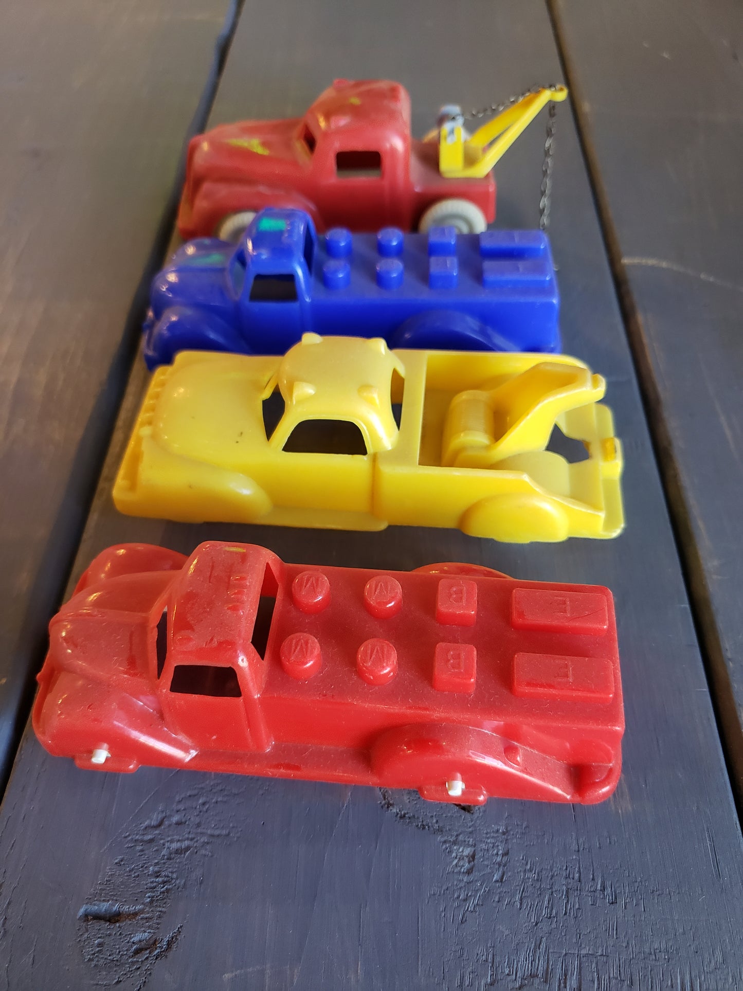 1950's set of four plastic toy autos