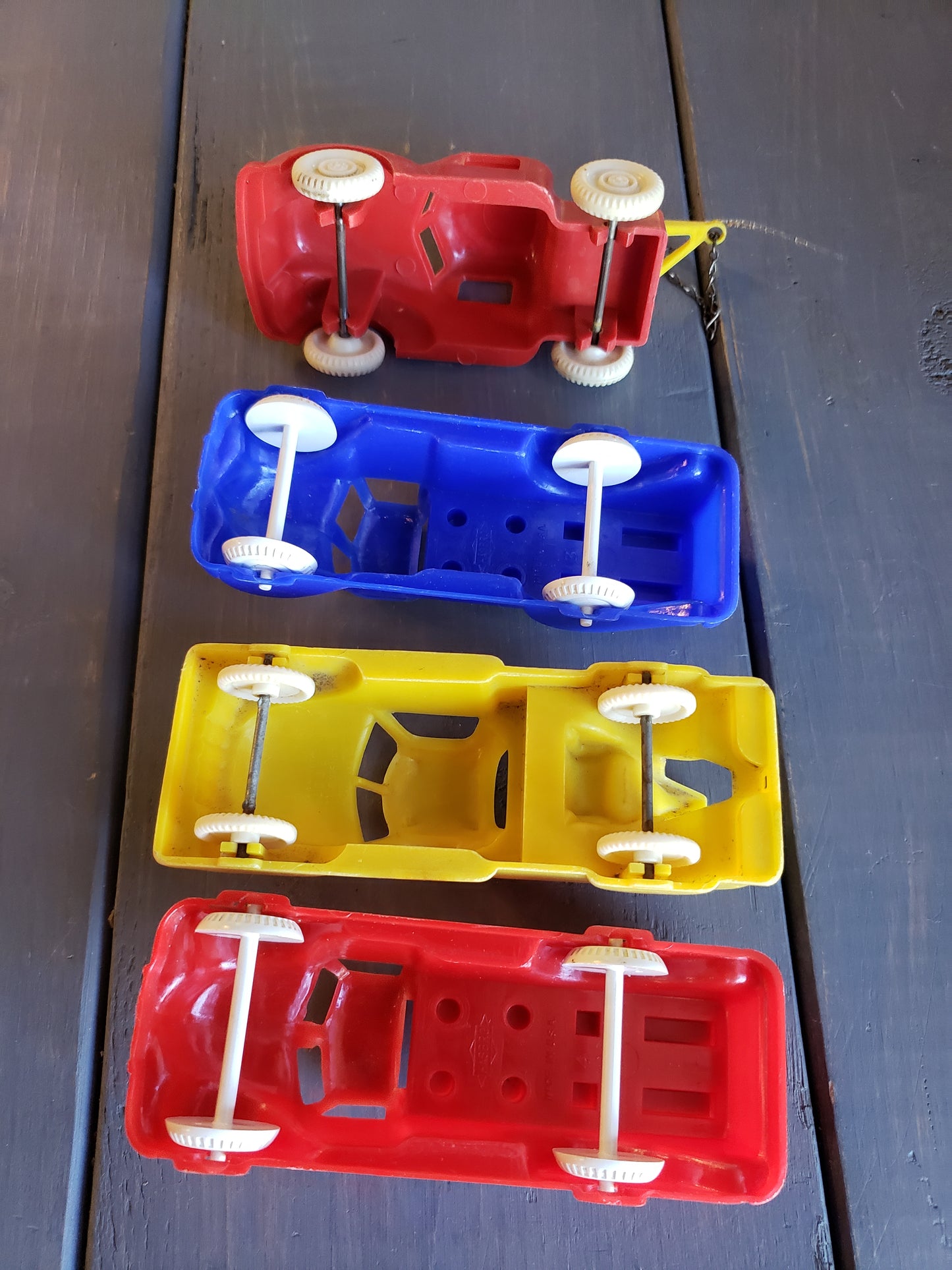 1950's set of four plastic toy autos