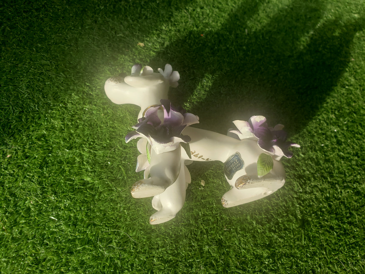 Norcrest (Japan) poodle with purple flowers