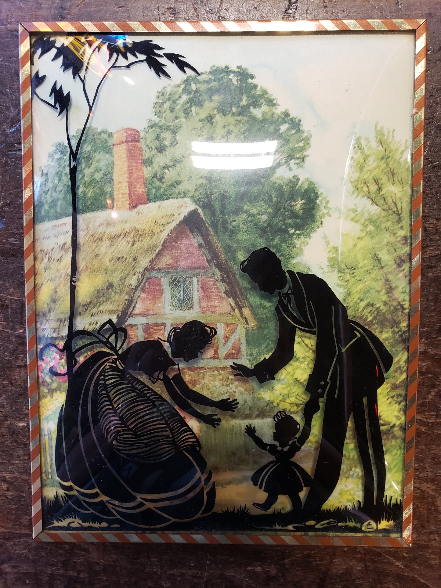 Silhouette Bubble Glass picture of family with toddler