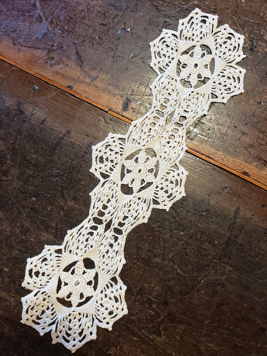 Crocheted triple medallion doily