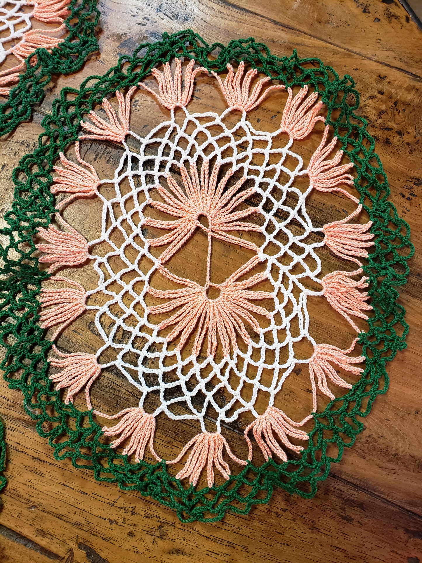 Set of three white, green and peach doilies