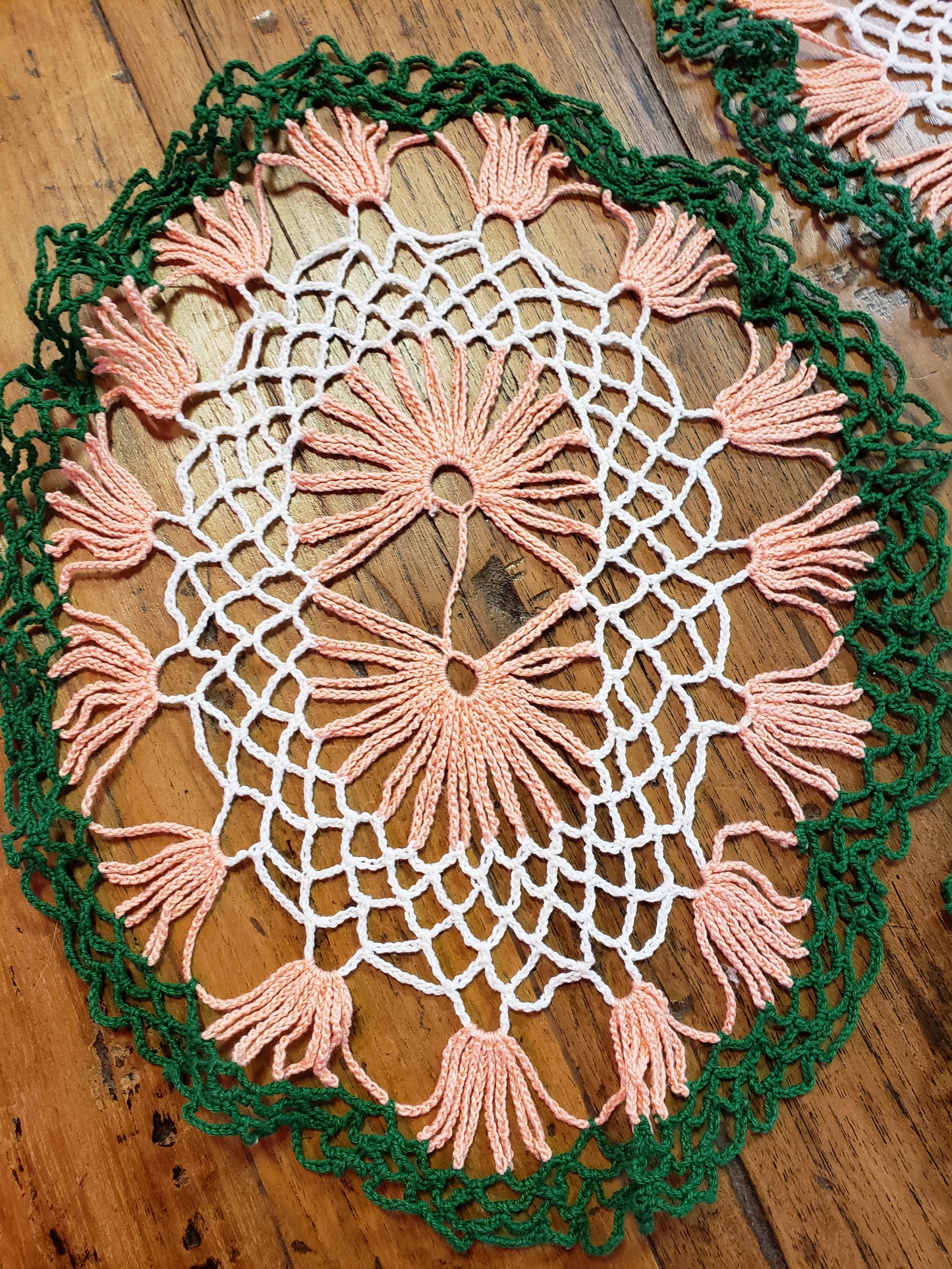 Set of three white, green and peach doilies