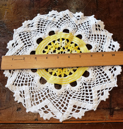 Round white and yellow doily