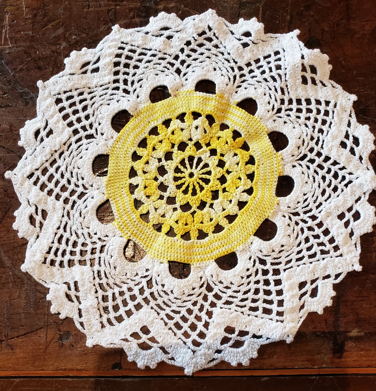 Round white and yellow doily