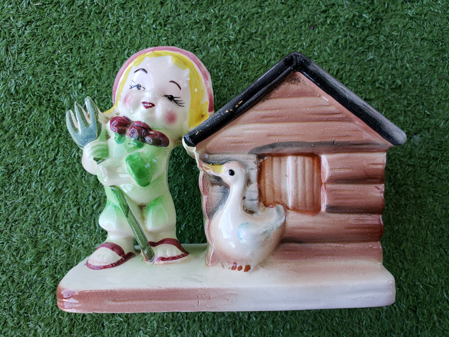 Blonde Farmer with Duck by Cabin planter