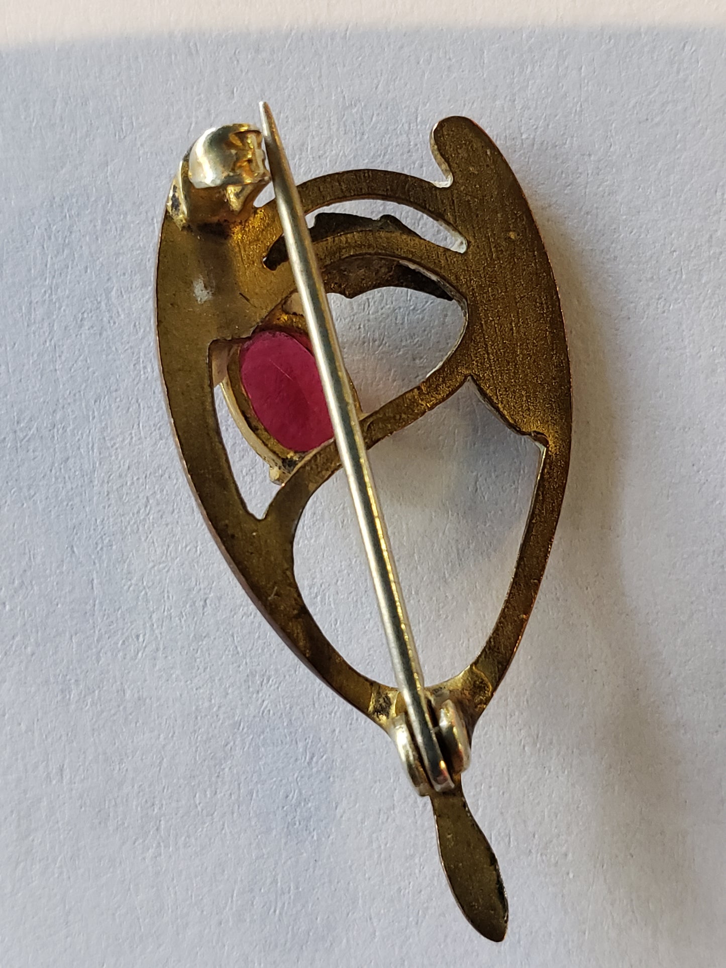 Wishbone pin with red gem