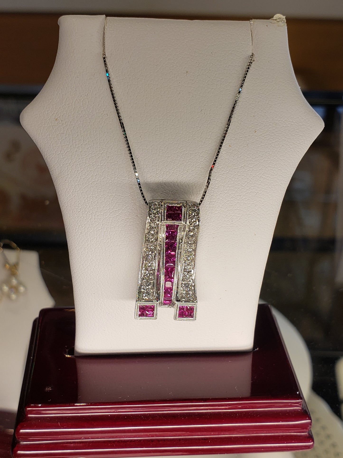 14K white gold necklace with diamonds and rubies