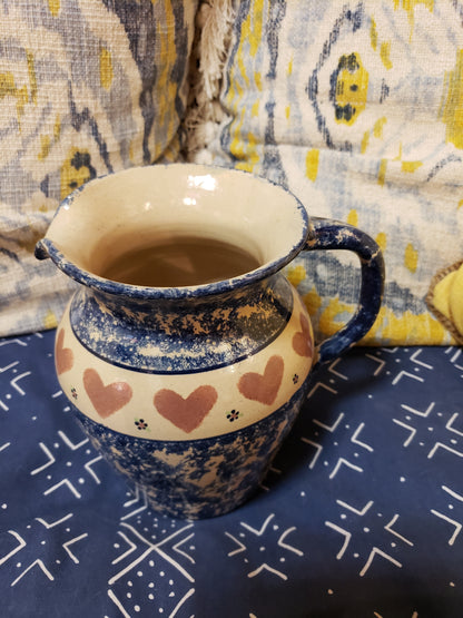 Blue speckled stoneware pitcher with hearts