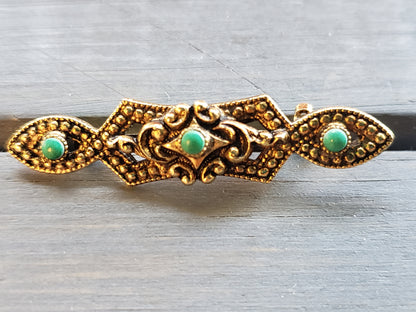 Brass Pin with tiny green stones