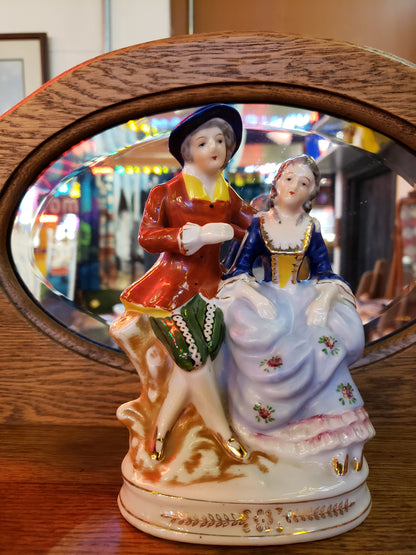 Porcelain figurine of Grey Haired Man & Woman