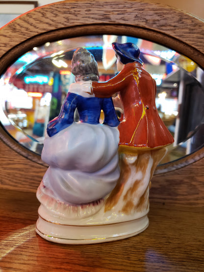 Porcelain figurine of Grey Haired Man & Woman