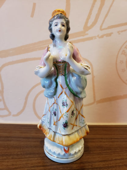 Bisque figurine of Victorian Lady with uplifted hands