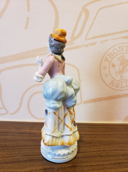 Bisque figurine of Victorian Lady with uplifted hands