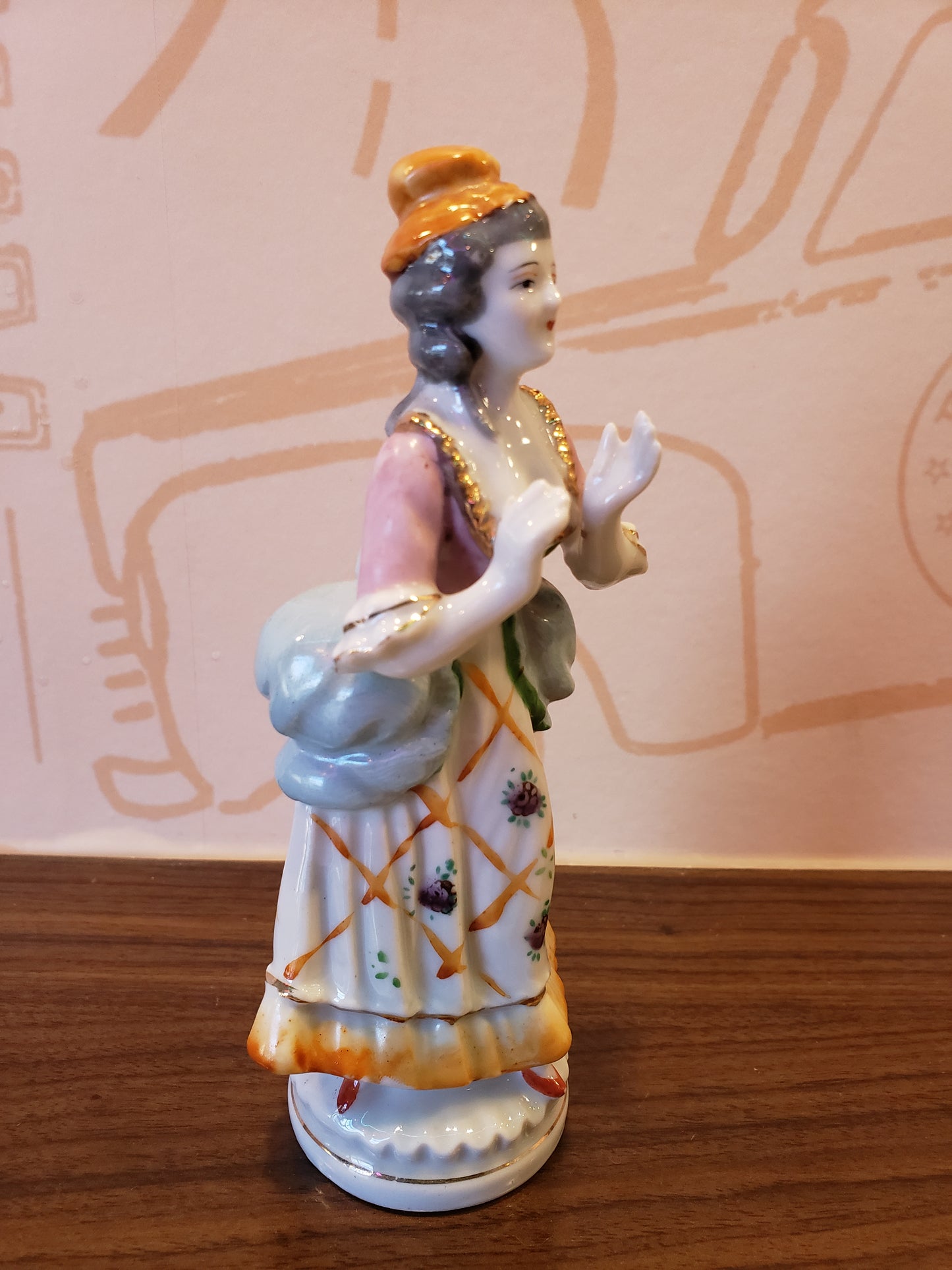 Bisque figurine of Victorian Lady with uplifted hands