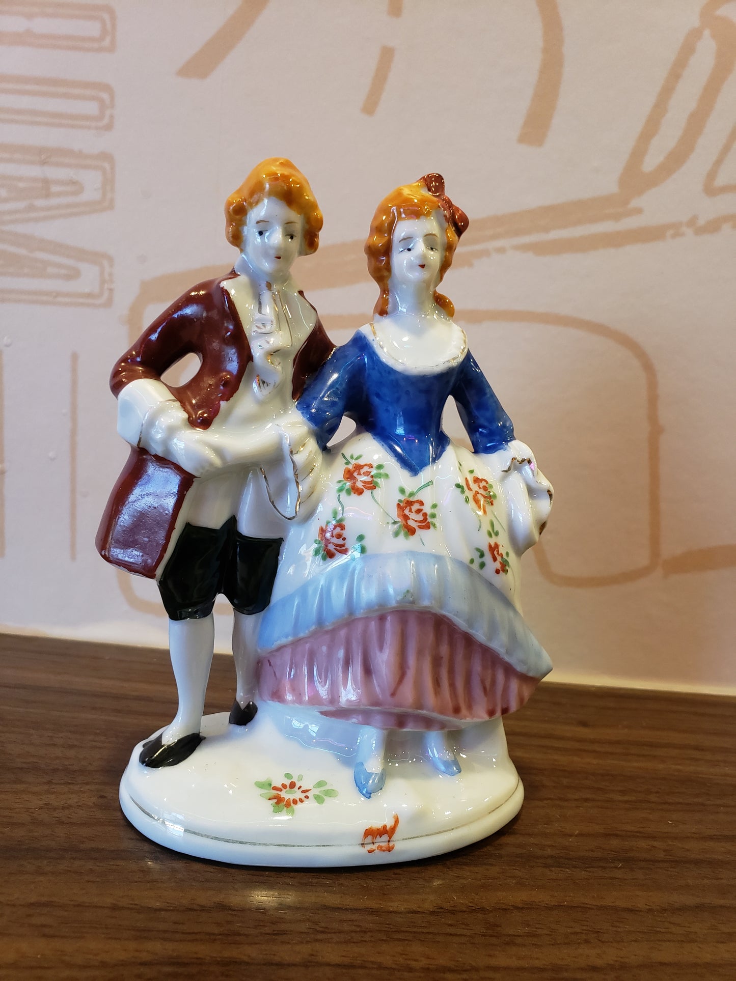 Victorian couple with orange hair figurine