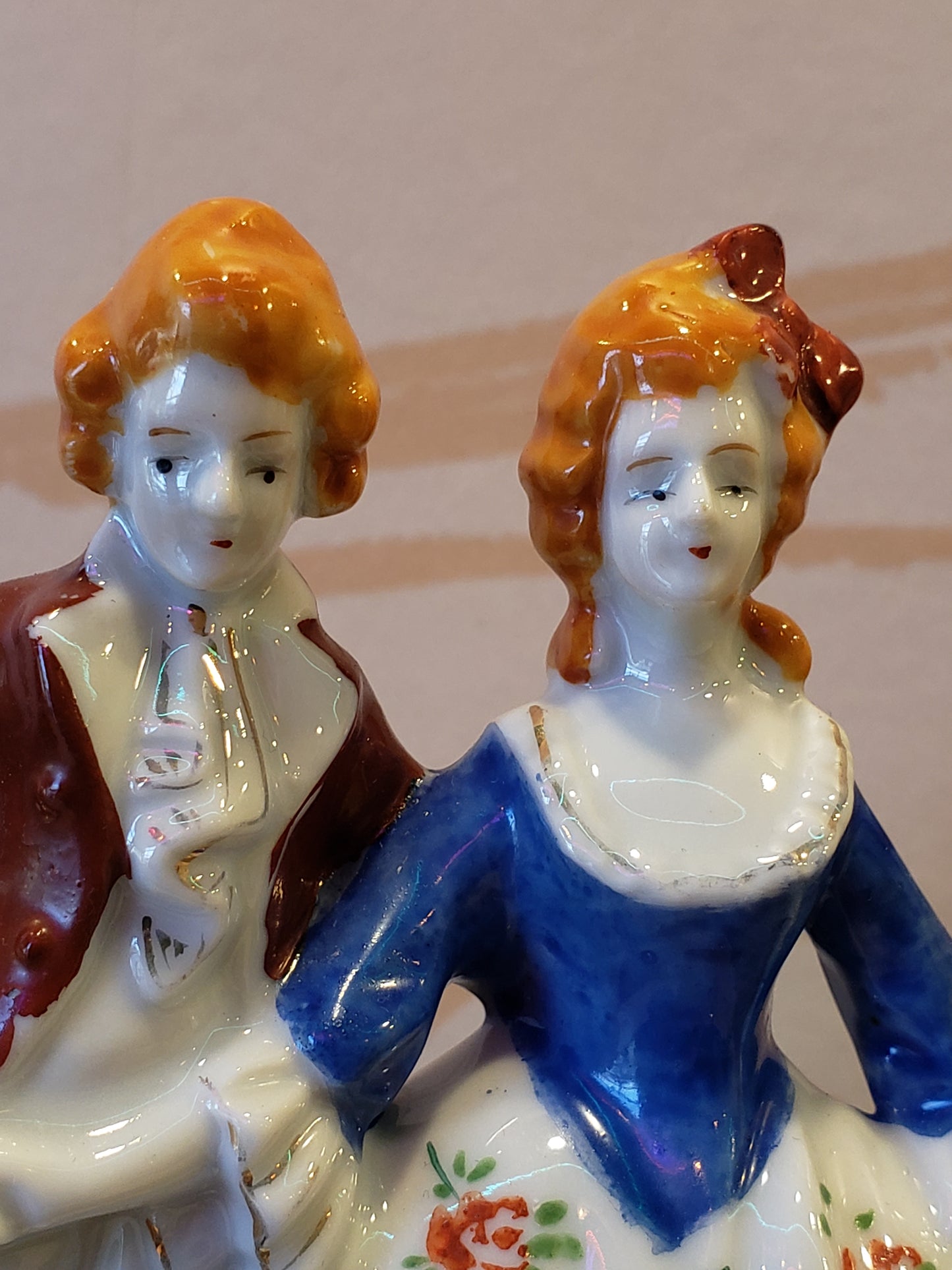 Victorian couple with orange hair figurine