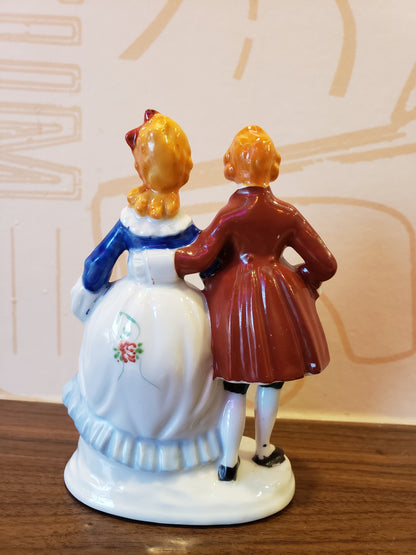 Victorian couple with orange hair figurine