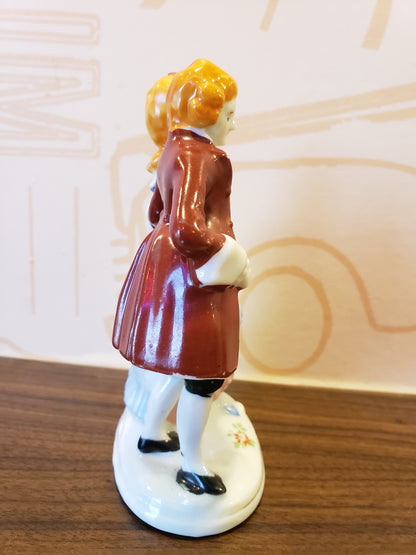 Victorian couple with orange hair figurine