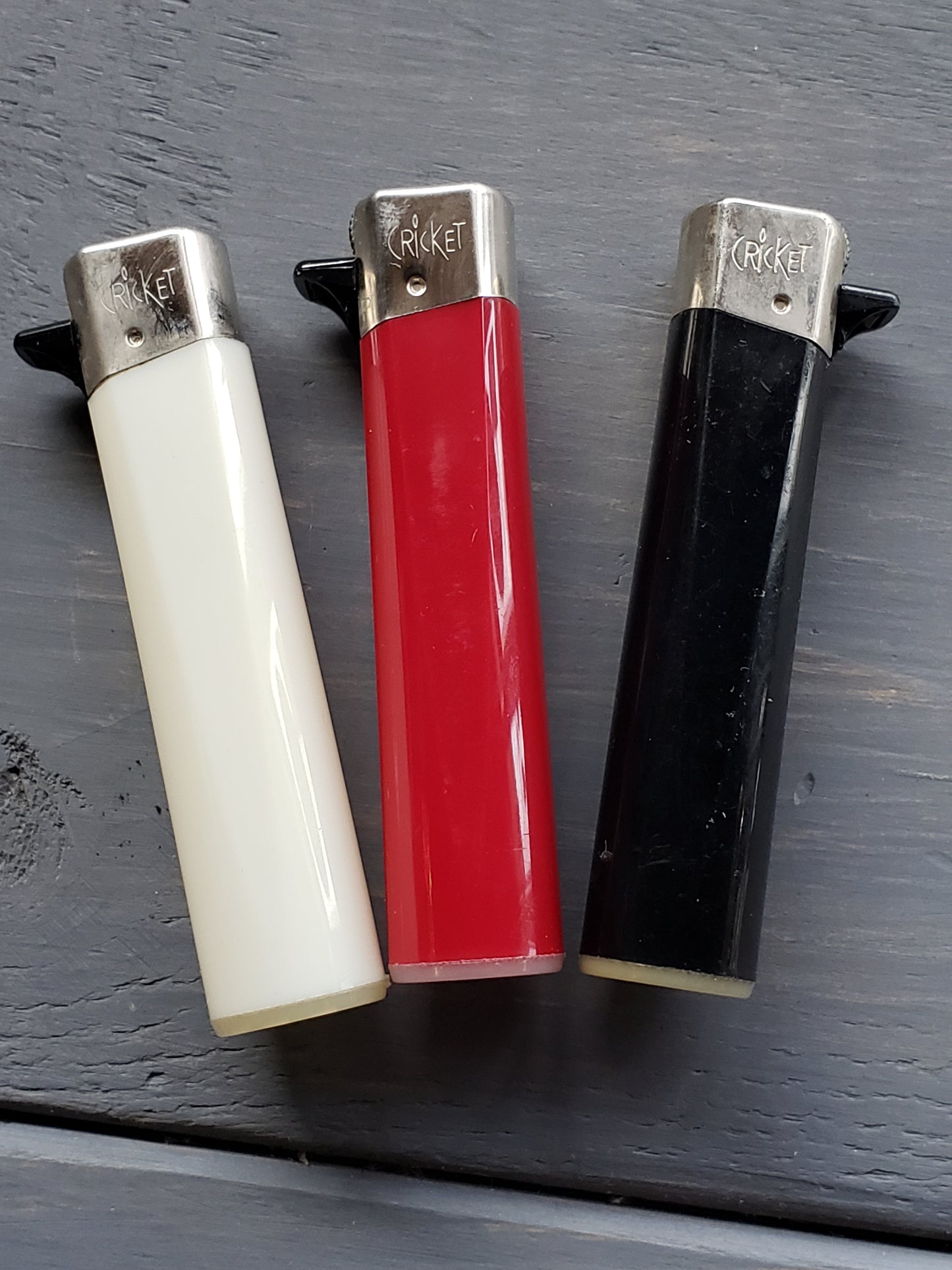 Set of three Cricket lighters from the 1990s