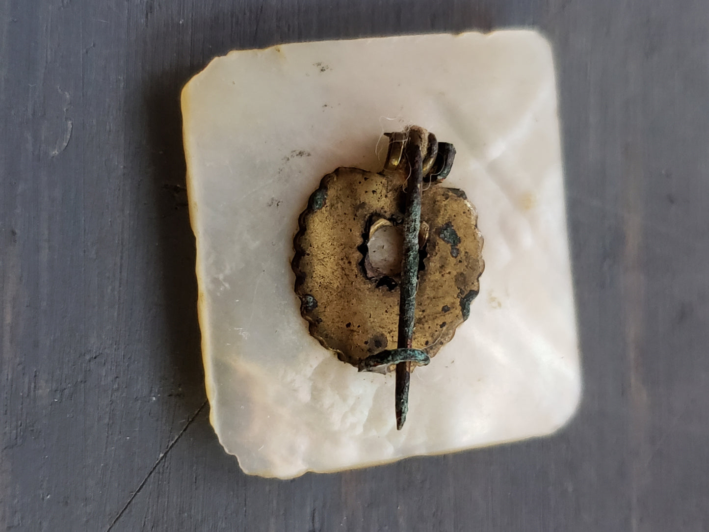 Very old mother of pearl lapel pin