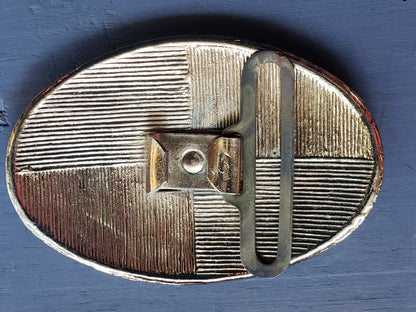 Oval gold tone floral scroll belt buckle