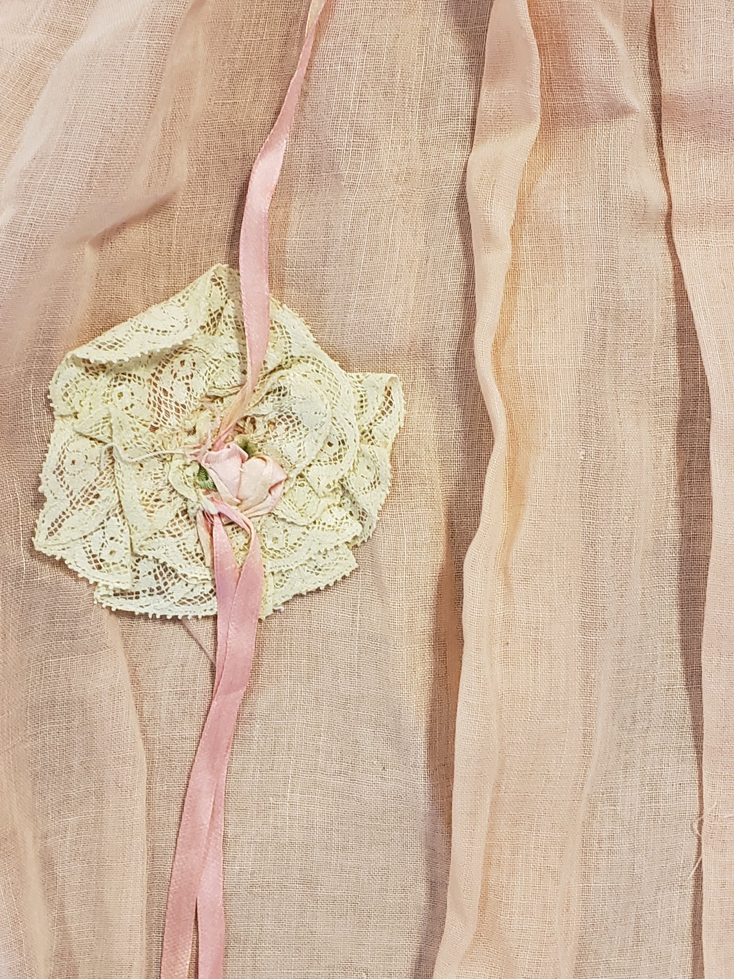 Peach baby dress with lace rosettes