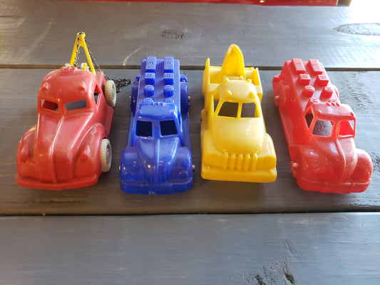 1950's set of four plastic toy autos