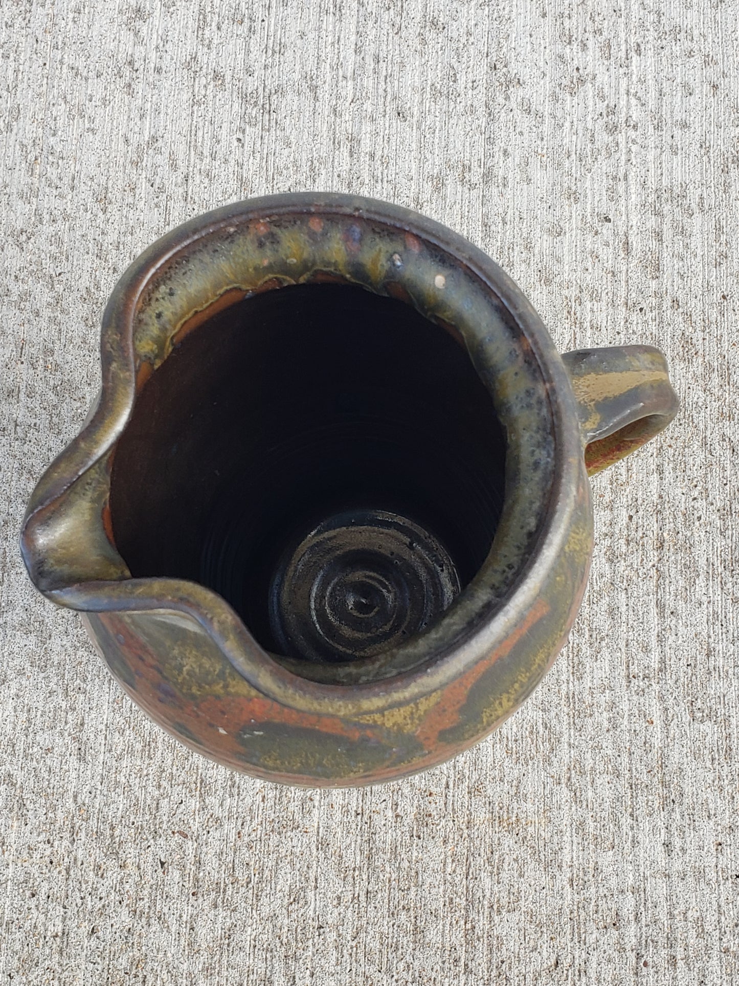 Green print glazed pottery pitcher