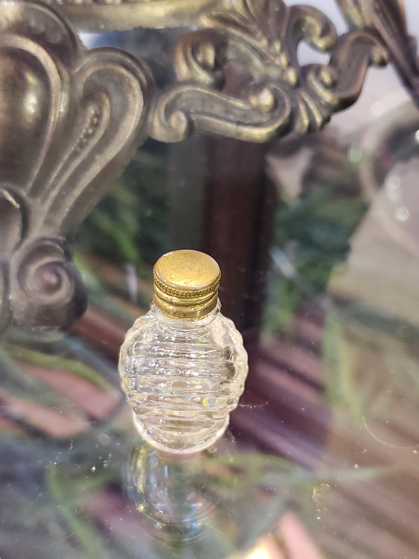 Tiny glass perfume bottle