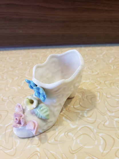 Delicate white porcelain shoe with flowers