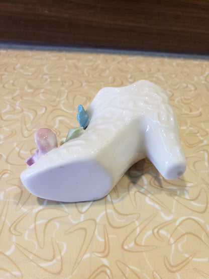 Delicate white porcelain shoe with flowers