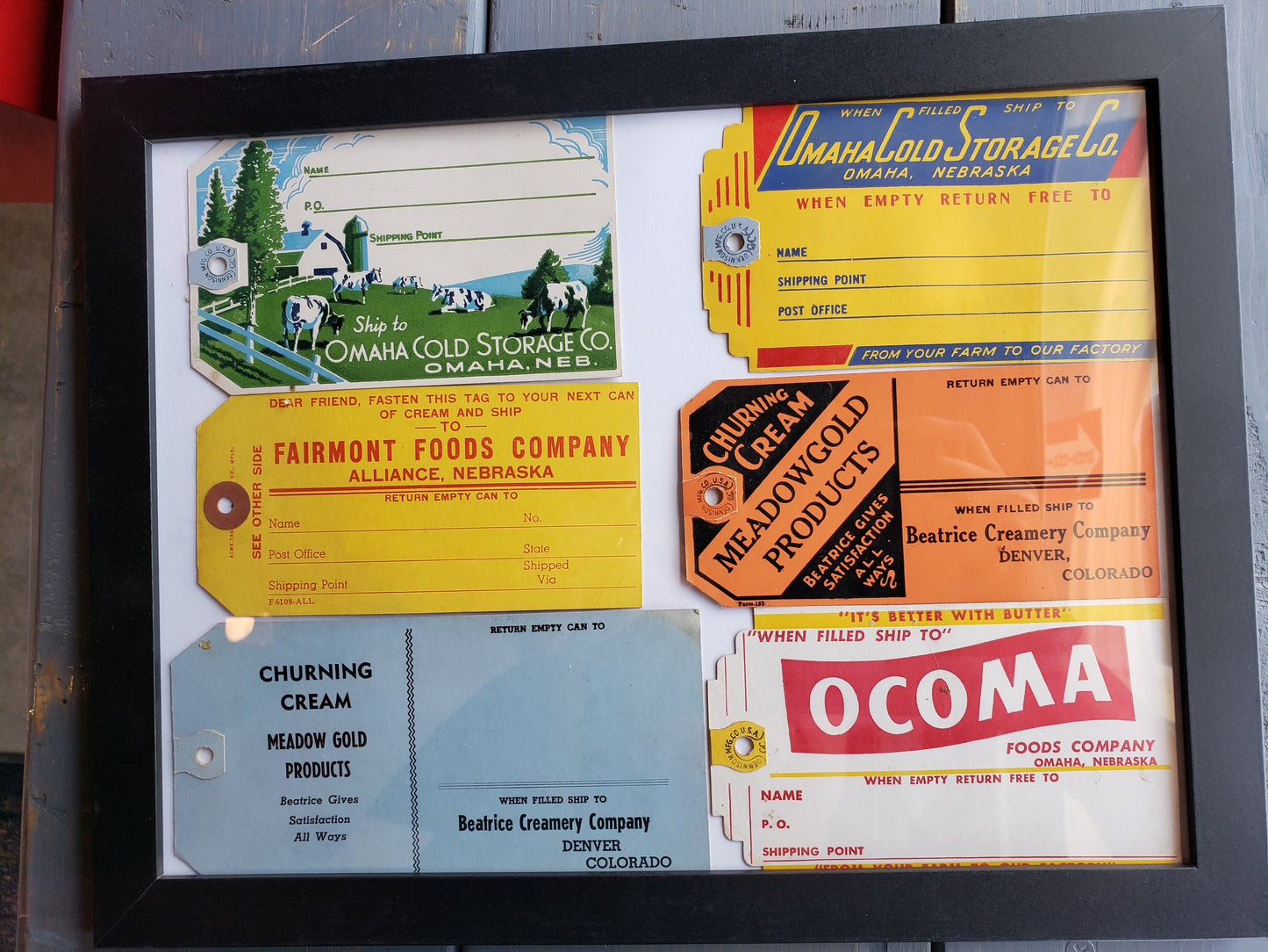 Frame with 6 vintage cream tags