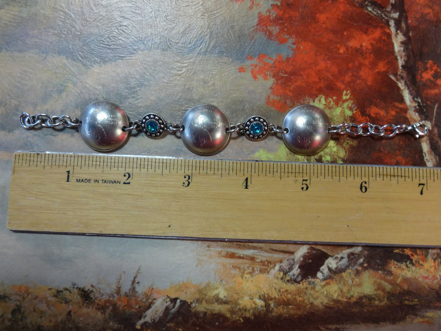 Bracelet with 3 Wyoming Quarters and two light blue and silvertone beads